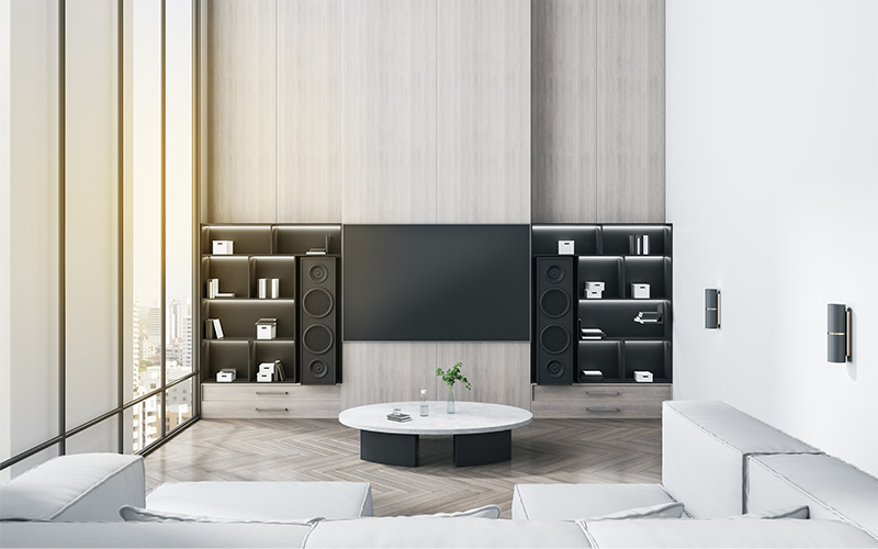 Modern living room with TV and shelves.